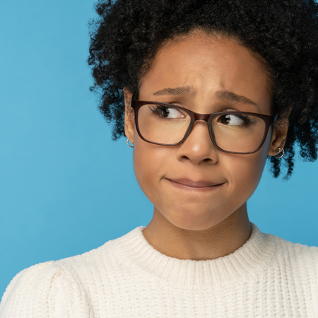 Young African American woman portraing concern over enamel hypolasia treatment
